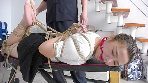 Slender Asian Girl With Sexy Legs Is Introduced To Bondage