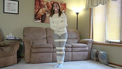 Jennifer straitjacketed, belted, and gagged